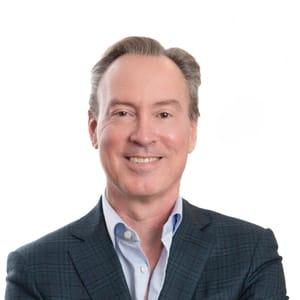 Tim Hayes Headshot. White adult male wearing gray suit.
